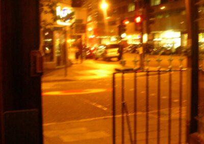 A blurry photograph of Tottenham Court Road from a pub