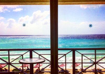 A view of the Caribbean Ocean from a hotel bedroom window
